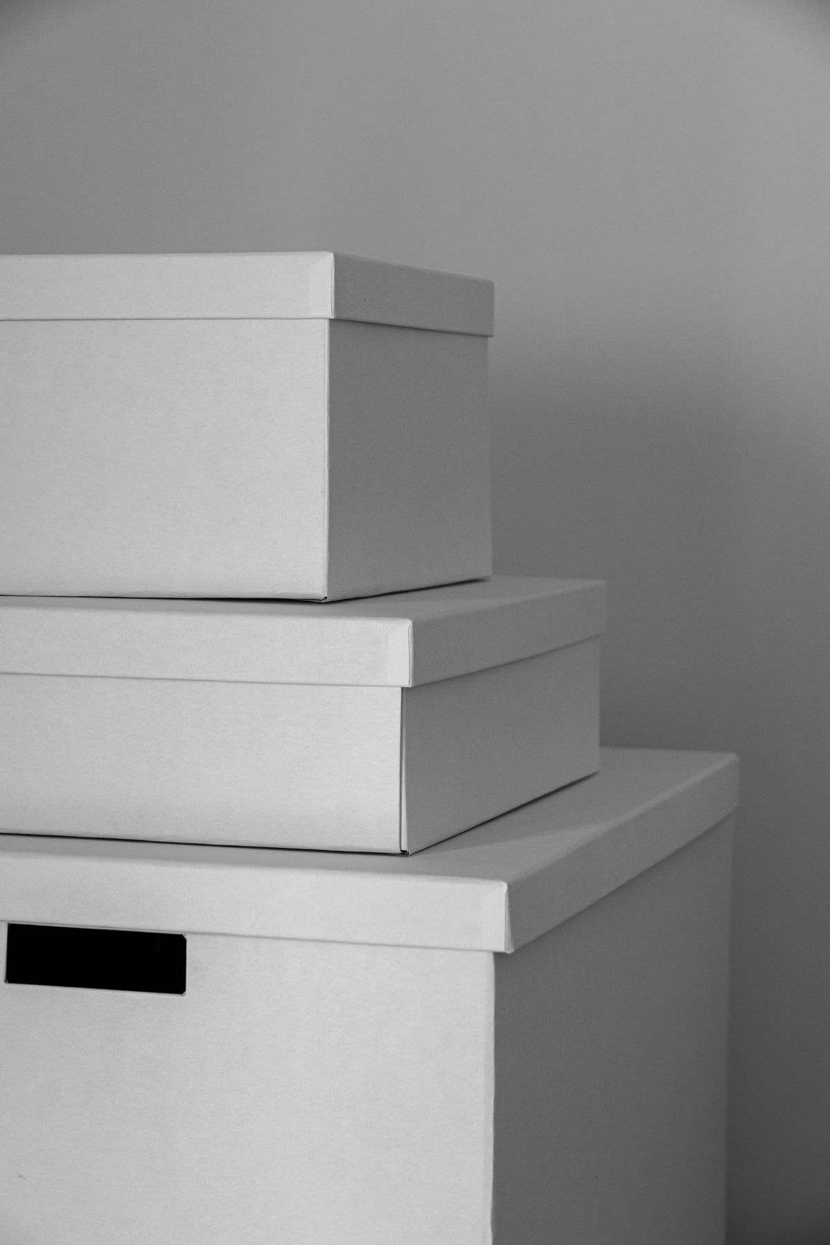 White storage boxes nested inside one another